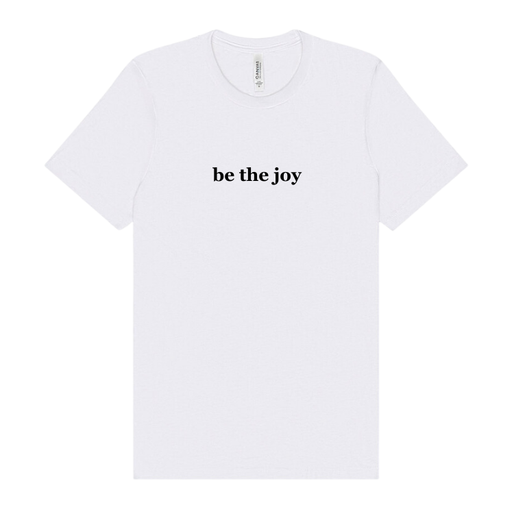 a white tshirt emblazoned with the words be the joy