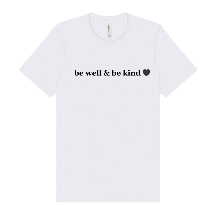 White t-shirt embellished with the words be well and be kind.