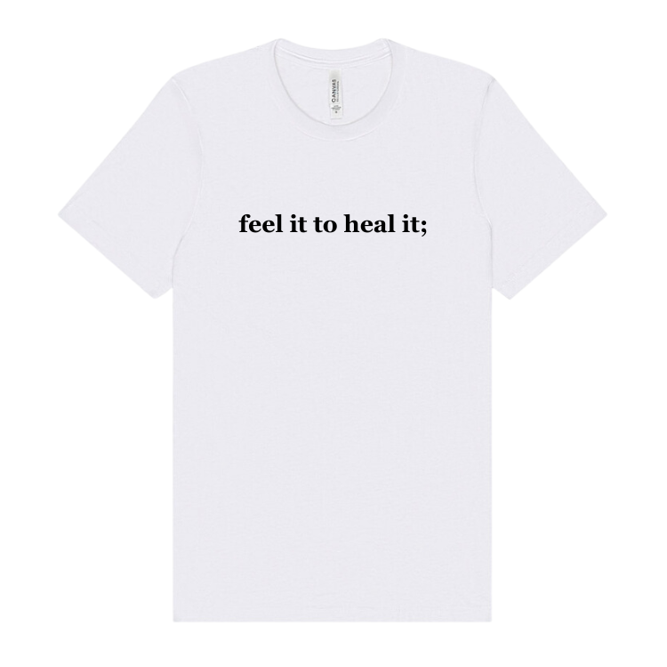 White tshirt emblazoned with the saying feel it to heal it