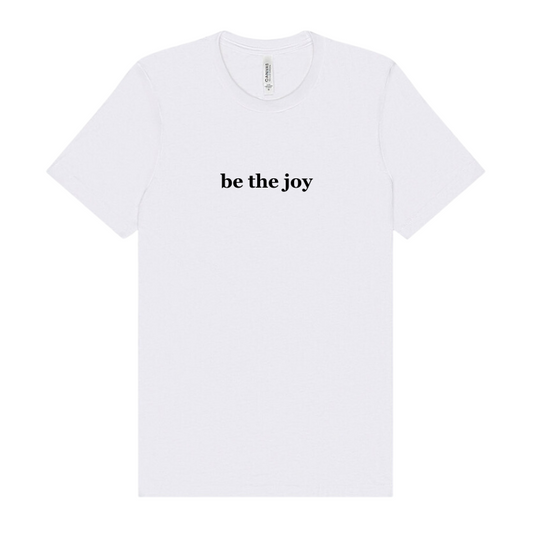 a white tshirt emblazoned with the words be the joy