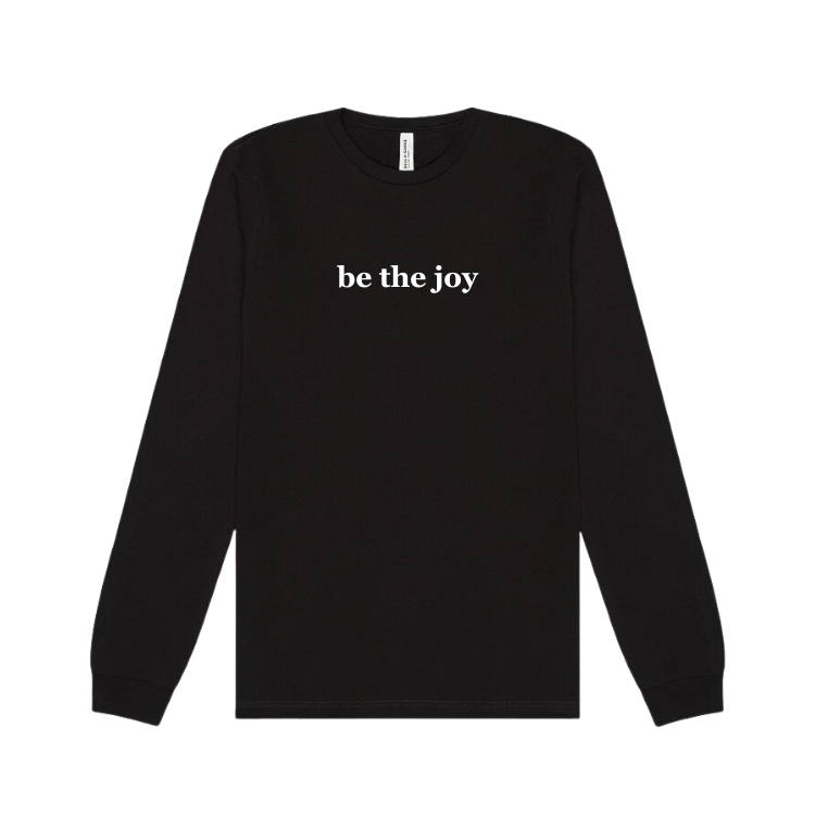 long sleeve black shirt emblazoned with the phrase be the joy