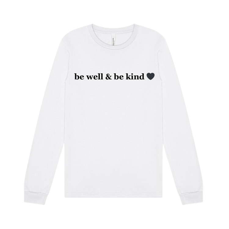 long sleeve white tee emblazoned with the phrase be well & be kind.